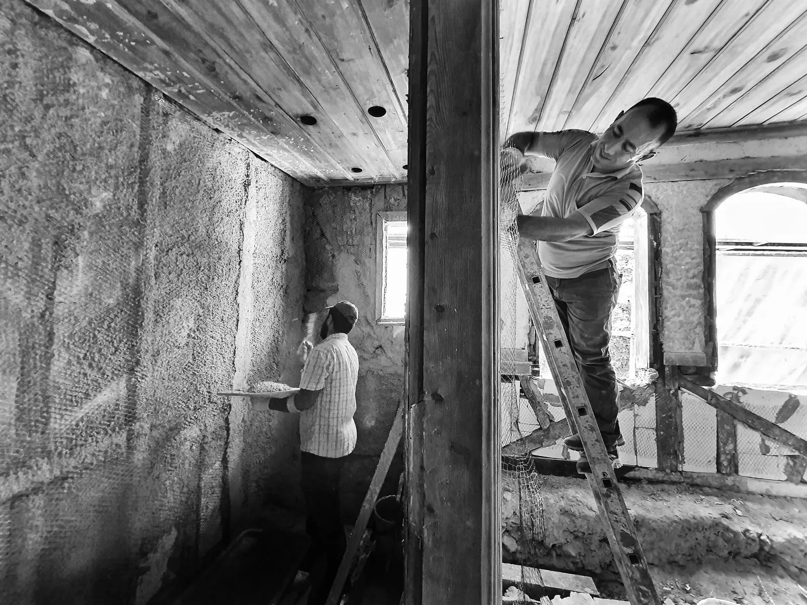 Contractors renovating a residential interior